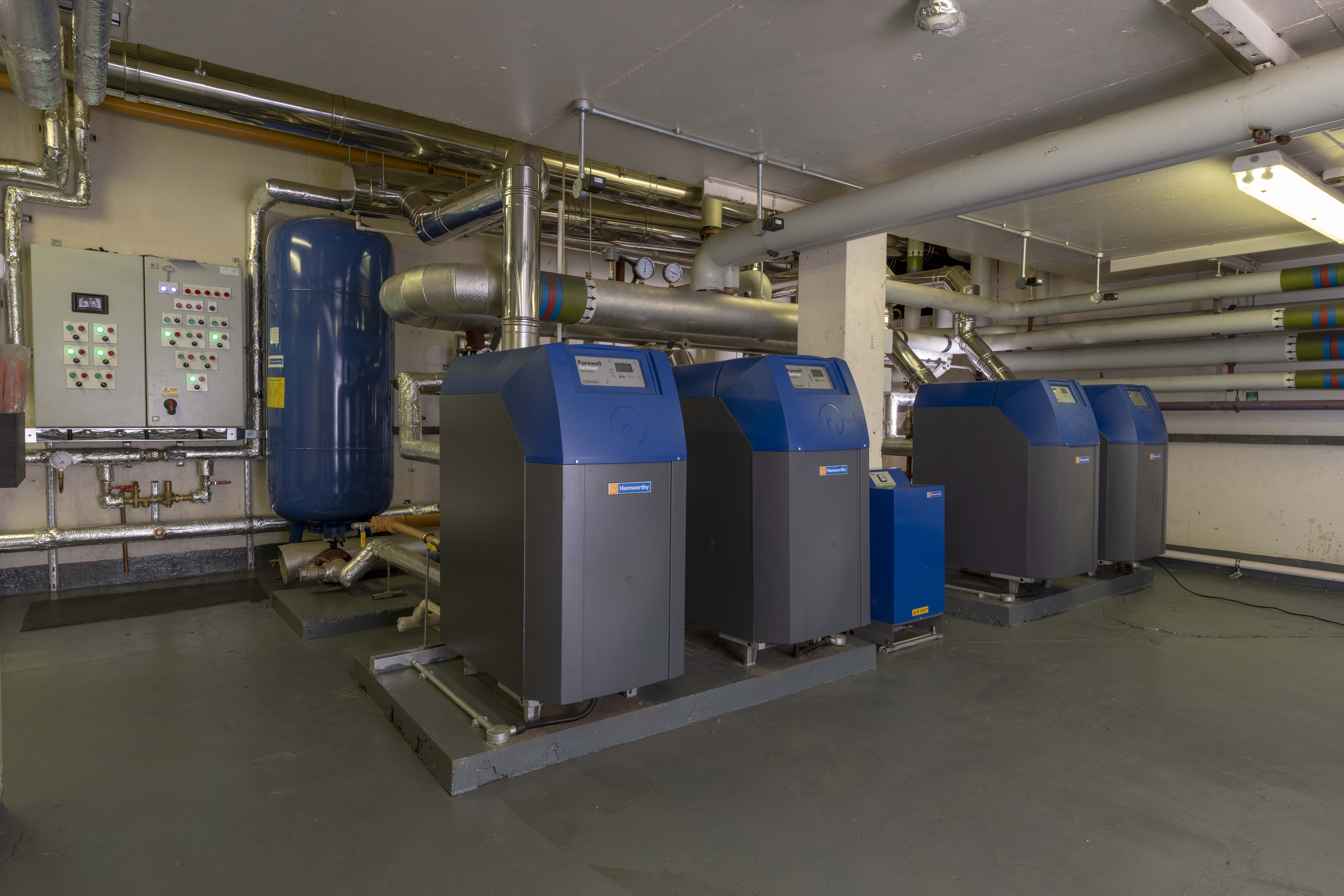Cast iron boilers and a closed and pressurised heating system.